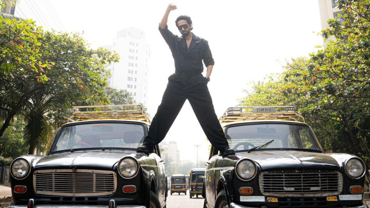 Actor Ayushmann Khurrana, who awaits the release of his upcoming film 'An Action Hero', has paid a tribute to Ajay Devgn in a very special style. Ayushmann attempted to recreate an Ajay Devgn moment where he is seen standing on top of two cars. He shared the picture on Instagram, wowing his fans as he does the stunt. He captioned the picture: 